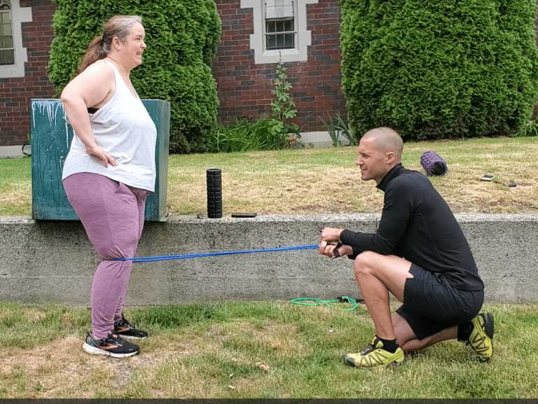 A fat girl doing knee replacement recovery exercises with her hot trainer